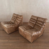 Pair of Cognac Channeled Leather Armless Lounge Chairs