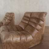 Pair of Cognac Channeled Leather Armless Lounge Chairs